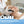 A person receiving a facial treatment lies on a bed while a gloved hand holds a black handheld device against the cheek. Three inset circles at the bottom show treatment areas labeled Neck, Face, and Eyes, with text reading 'Targeted Facial Rejuvenation' and a blue banner at the bottom.