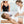 Woman receiving breast massage with a device, inset showing a black bra.