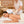 Woman receiving a massage with a professional in a spa setting.