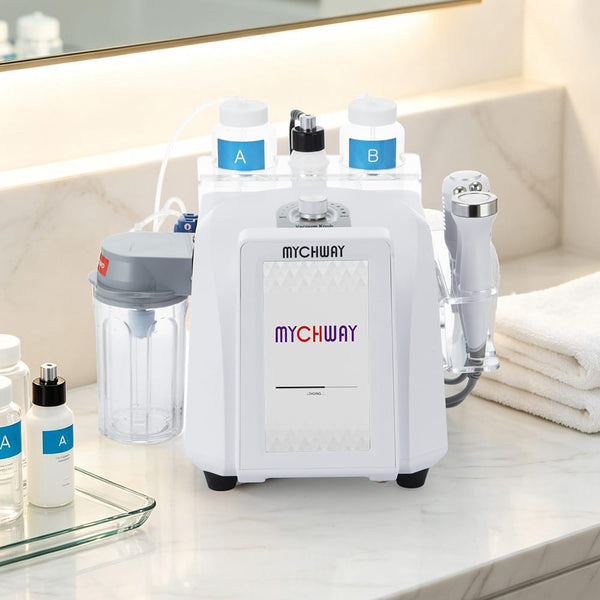 A white MYCHWAY facial treatment machine with two bottles labeled A and B, a clear collection cup, and a handheld applicator, displayed on a marble bathroom counter with folded towels nearby.