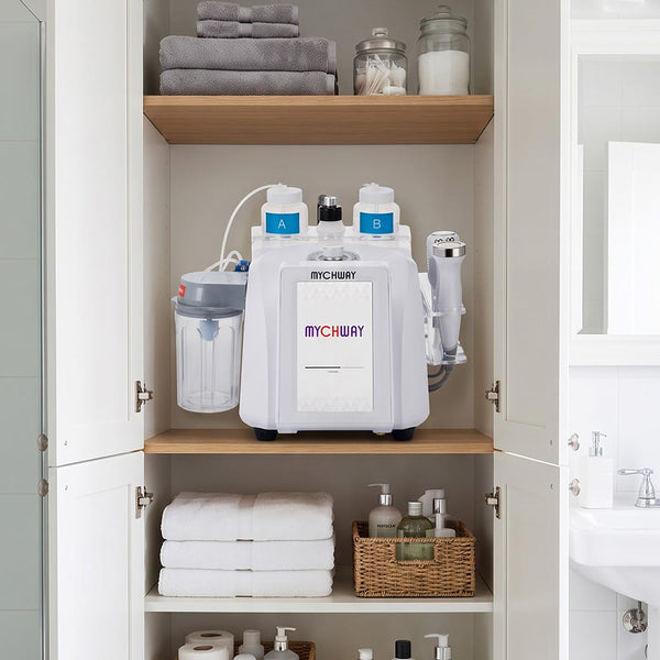 MYCHWAY 8-in-1 hydro dermabrasion machine stored neatly on a bathroom cabinet shelf alongside folded towels and skincare products, demonstrating compact at-home storage