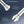 An informational graphic showing two close-up views of a metallic facial treatment handle against a dark blue gradient background, with text explaining hand-specific treatment capabilities.
