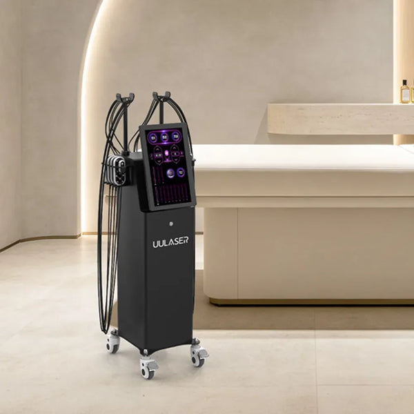 A Uulaser mobile beauty device with a black console and multiple attached black treatment arms, shown in a modern beige spa-like interior next to a treatment table.