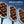 Three handheld laser body devices shown on a blue gradient background with text reading '650nm & 980nm Dual Wavelength Laser Body Sculpting Machine.' The devices have silver edges, black fronts, and glowing orange-red LED nodes with purple line graphics.